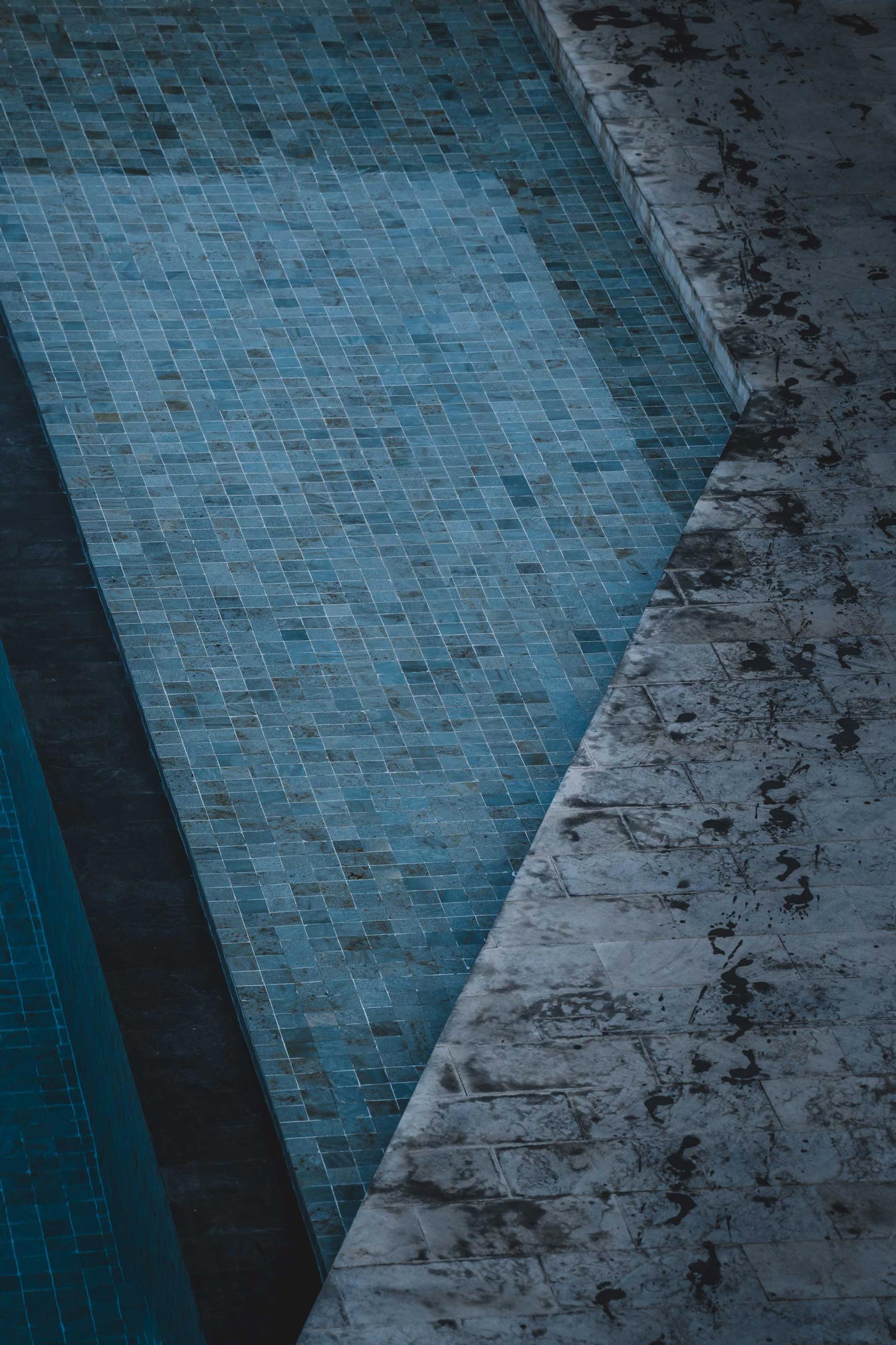 Top view of tiled recovery pool and stone deck at Wrong Gym Bali.