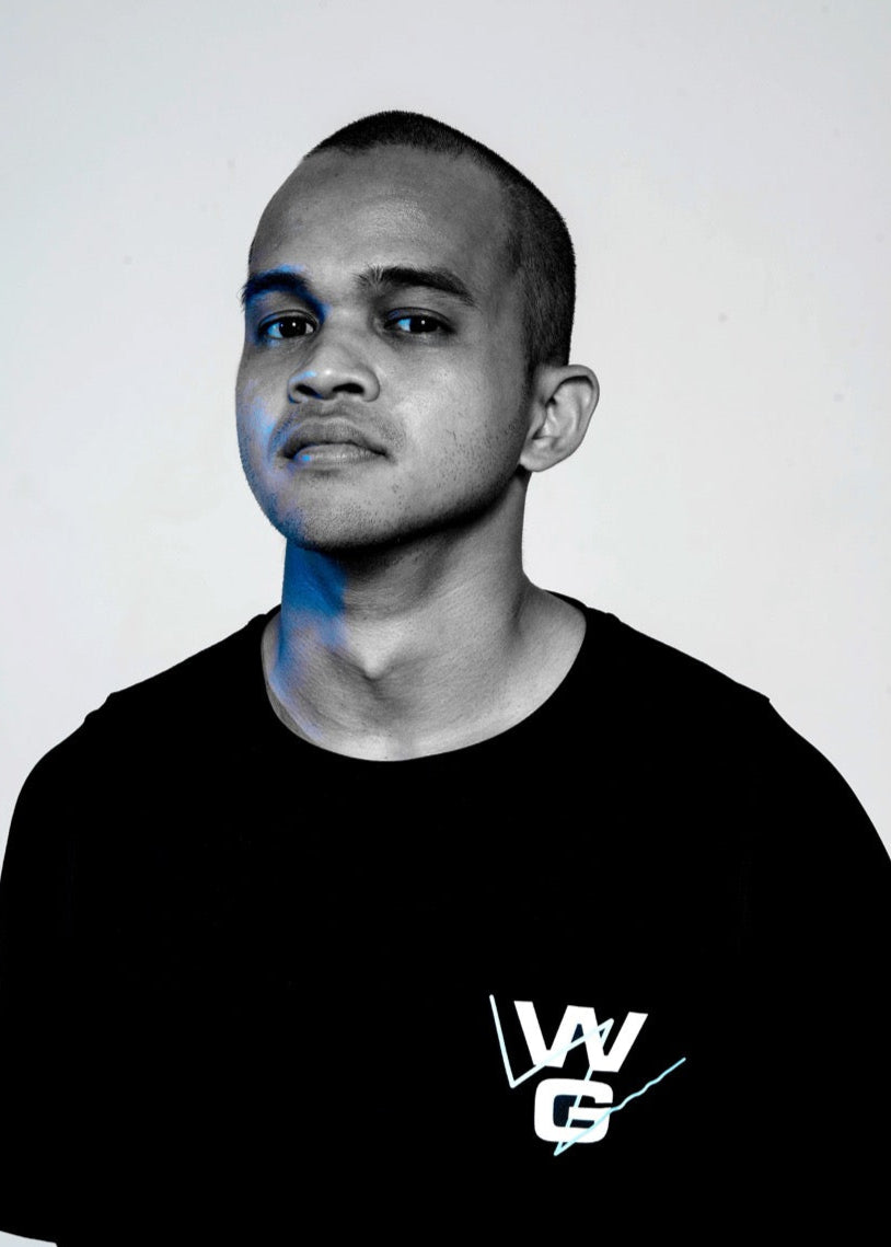Wrong Gym Bali trainer Norman in a black WG t-shirt, facing the camera with a confident, composed expression.